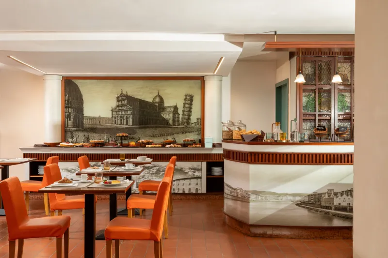 Breakfast room with tables and sweet buffet, welcoming space to start the day in a Pisa city center hotel - Hotel La Pace, BZAR hotels in Pisa