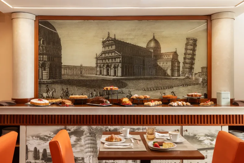 Breakfast buffet with fresh pastries and Pisa Tower decor, authentic experience in city center Pisa - Hotel La Pace, BZAR hotels in Pisa